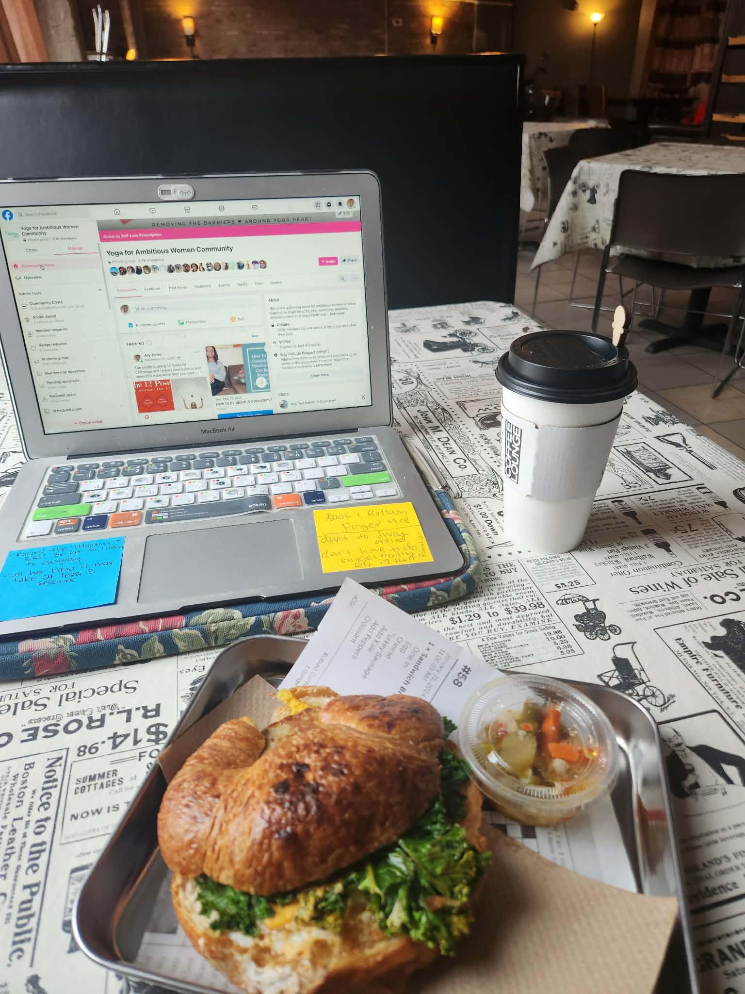 A busy morning with coffee, laptop, and croissant
