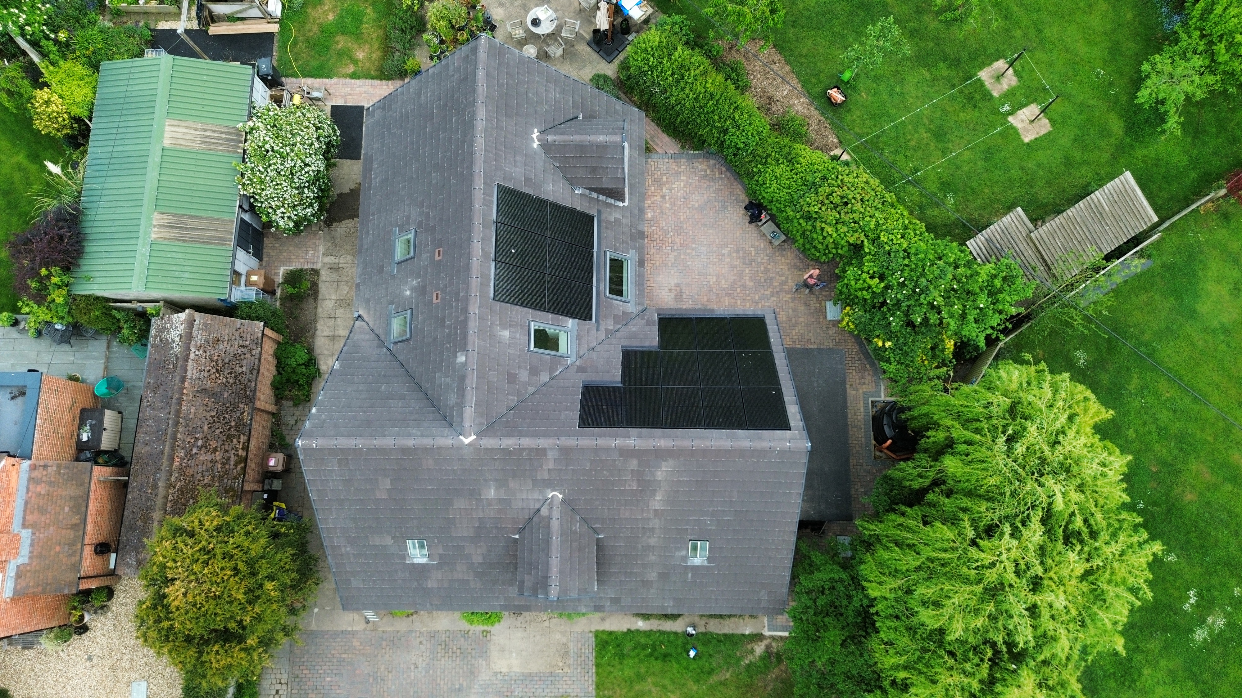 Aerial view of roofing project with solar panels
