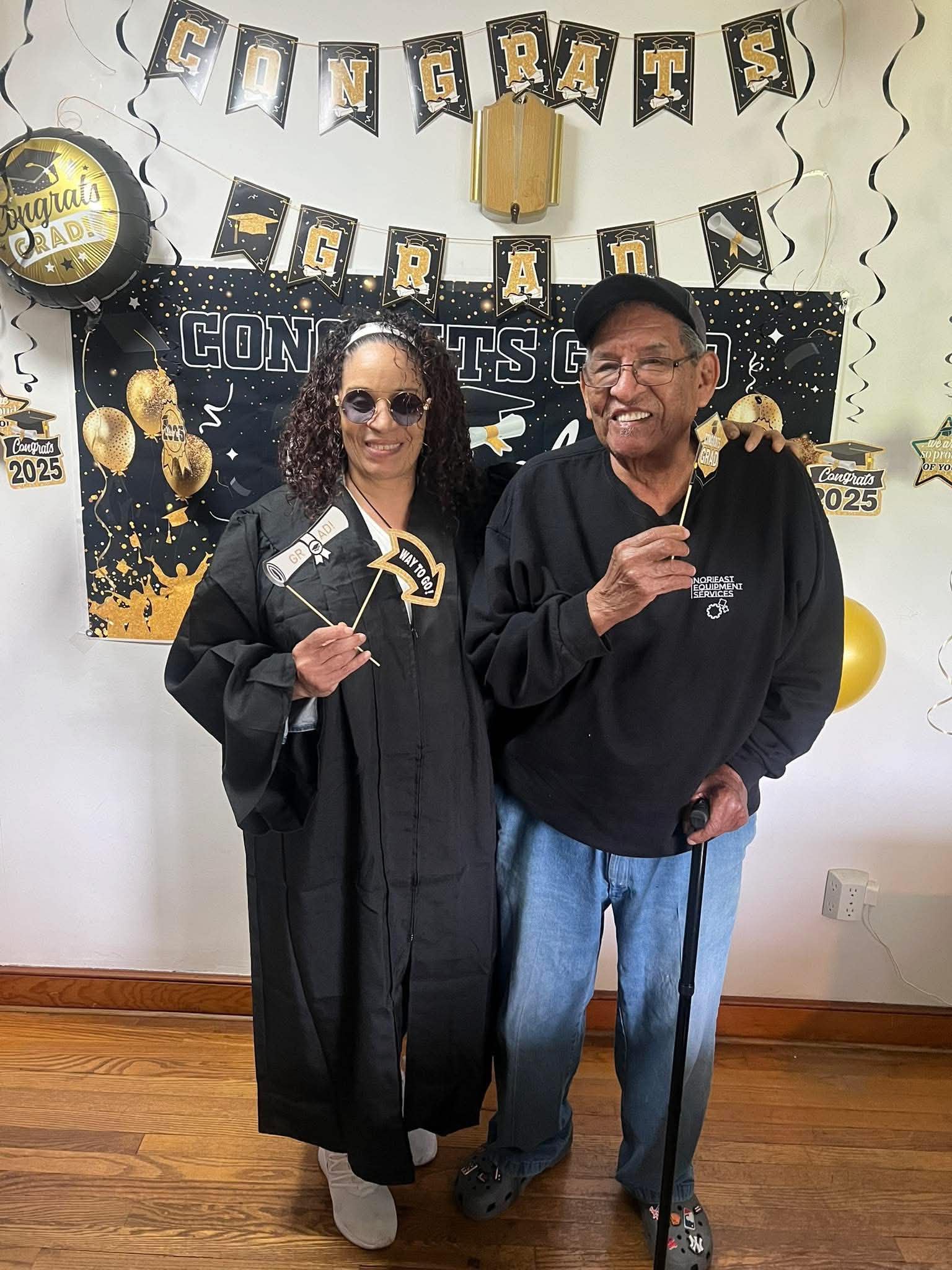 Daisy Olivo celebrating a family member's graduation milestone at a home celebration