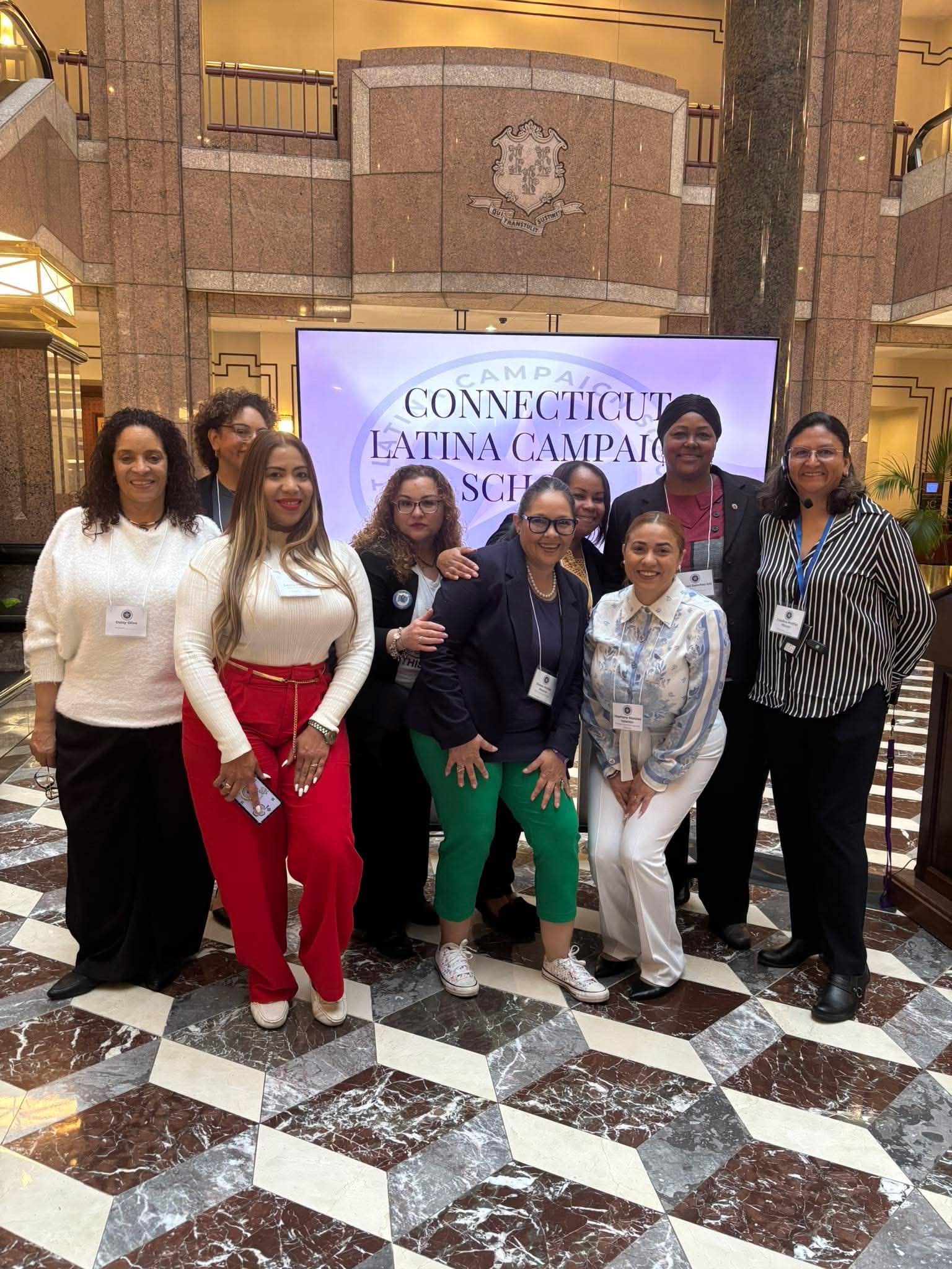 Daisy Olivo standing alongside fellow women leaders at the Connecticut State Capitol for the Latina Campaign School