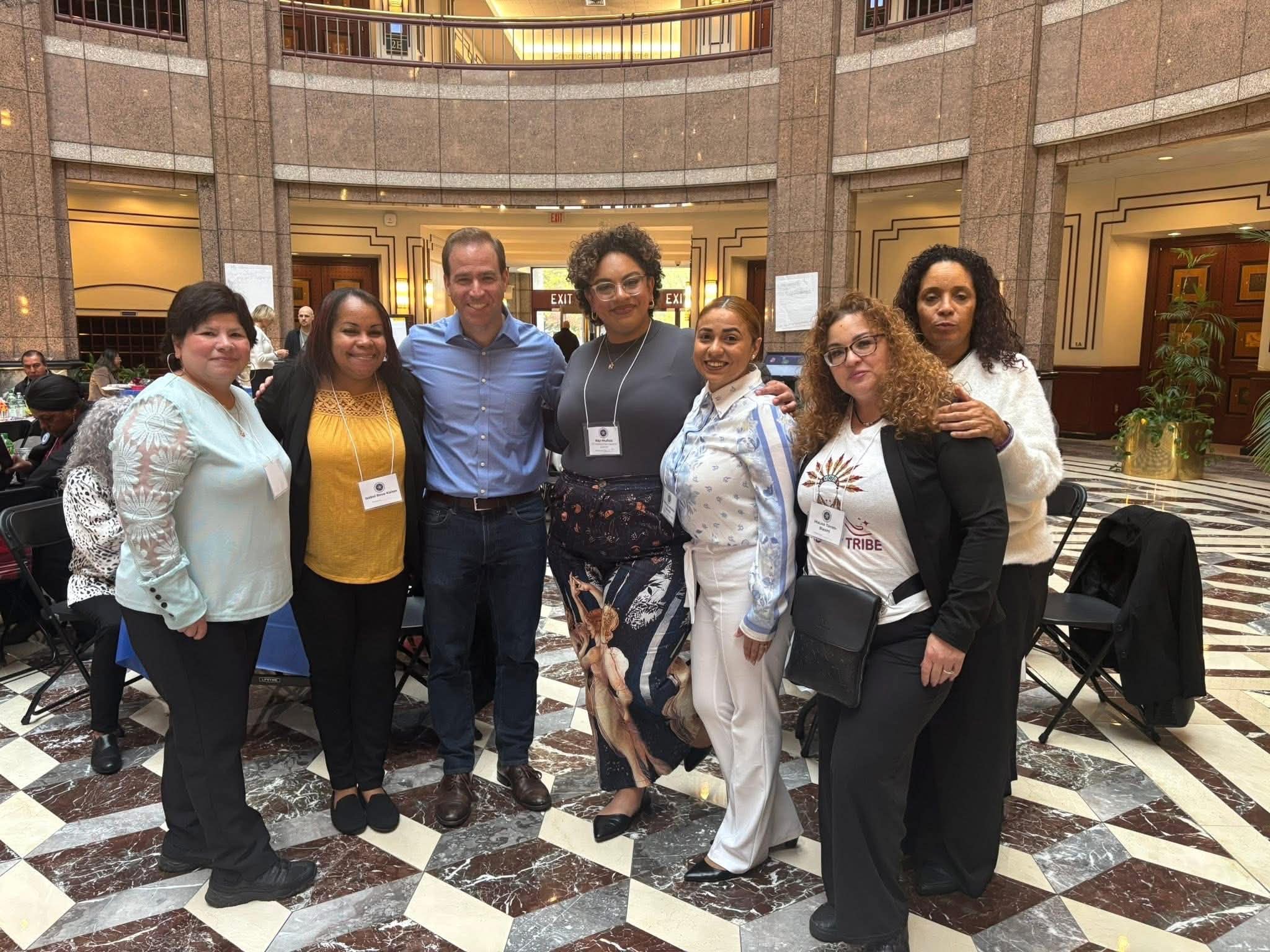 Daisy Olivo meeting with a Connecticut state legislator and fellow community advocates at the State Capitol