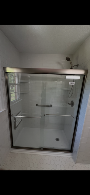 Subway Tile Conversion with Sliding Glass Enclosure