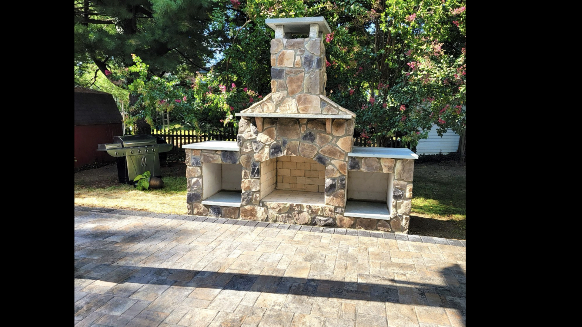 Natural Stone Outdoor Fireplace on Paver Patio