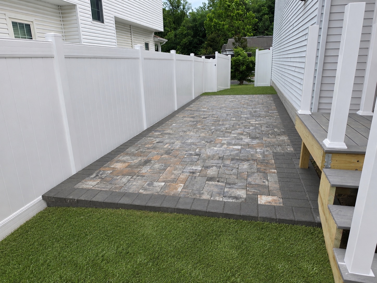 Custom Side Yard Paver Patio & White Vinyl Privacy Fence