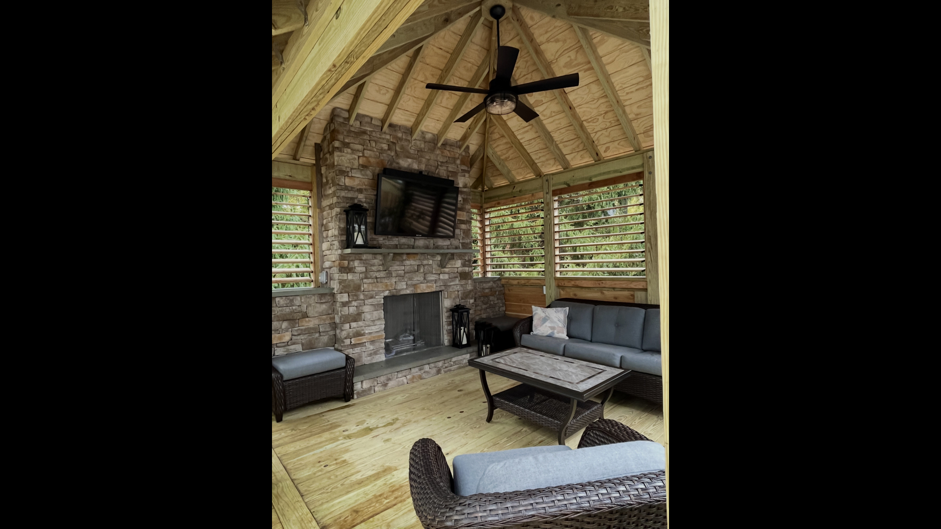 Covered Deck Pavilion Interior with Stone Fireplace