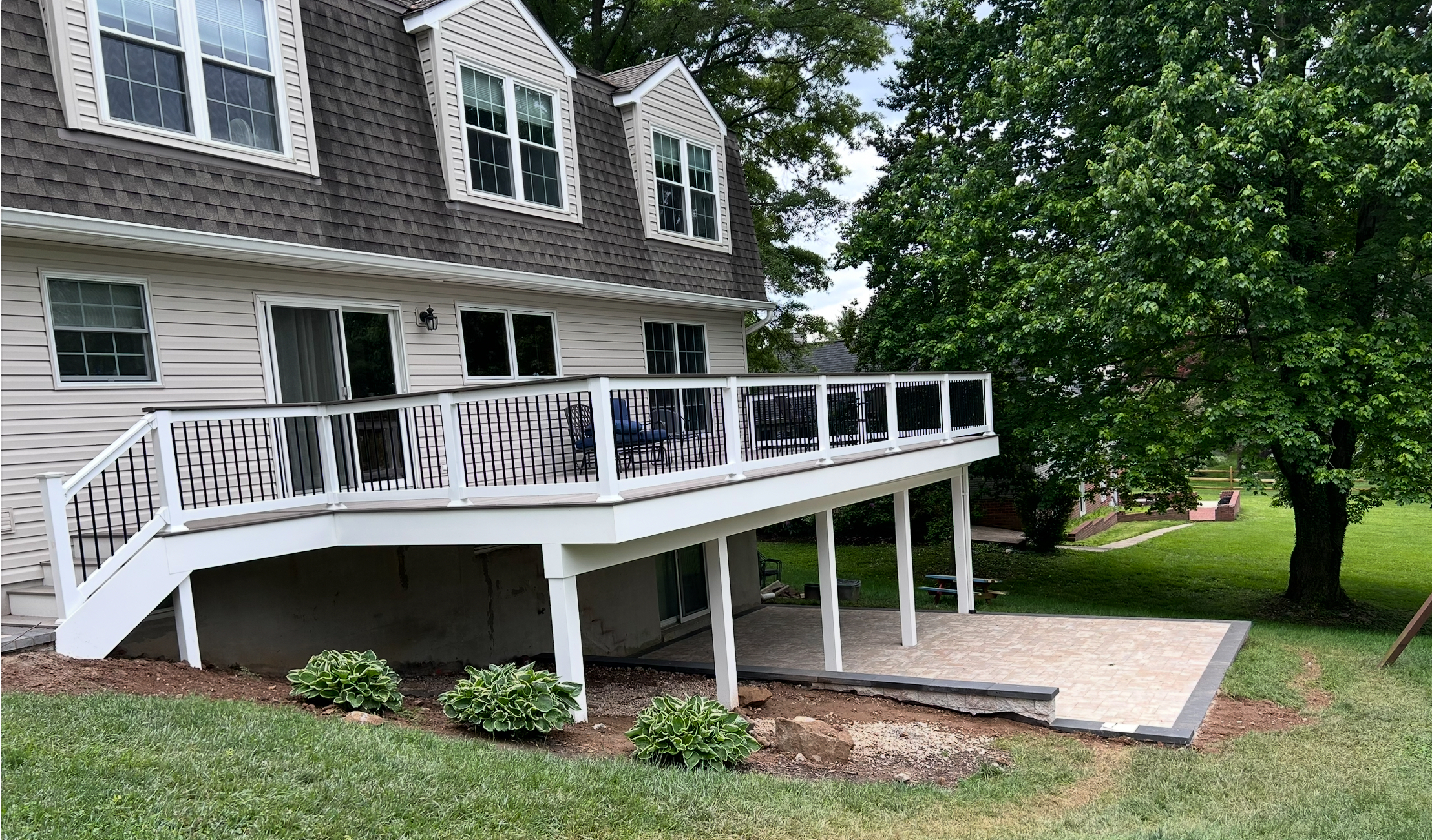 Elevated Composite Deck with White Railing & Black Balusters