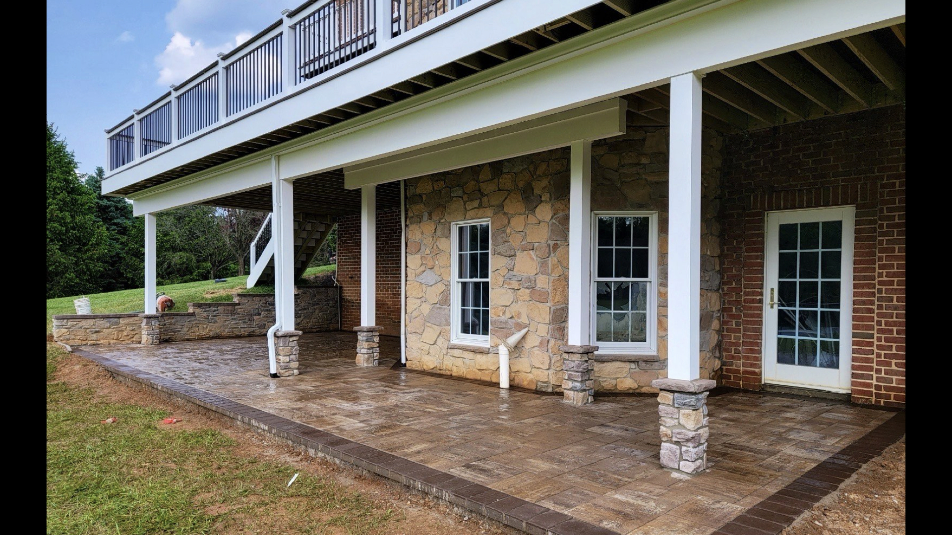 Covered Under-Deck Paver Patio with Stone Columns