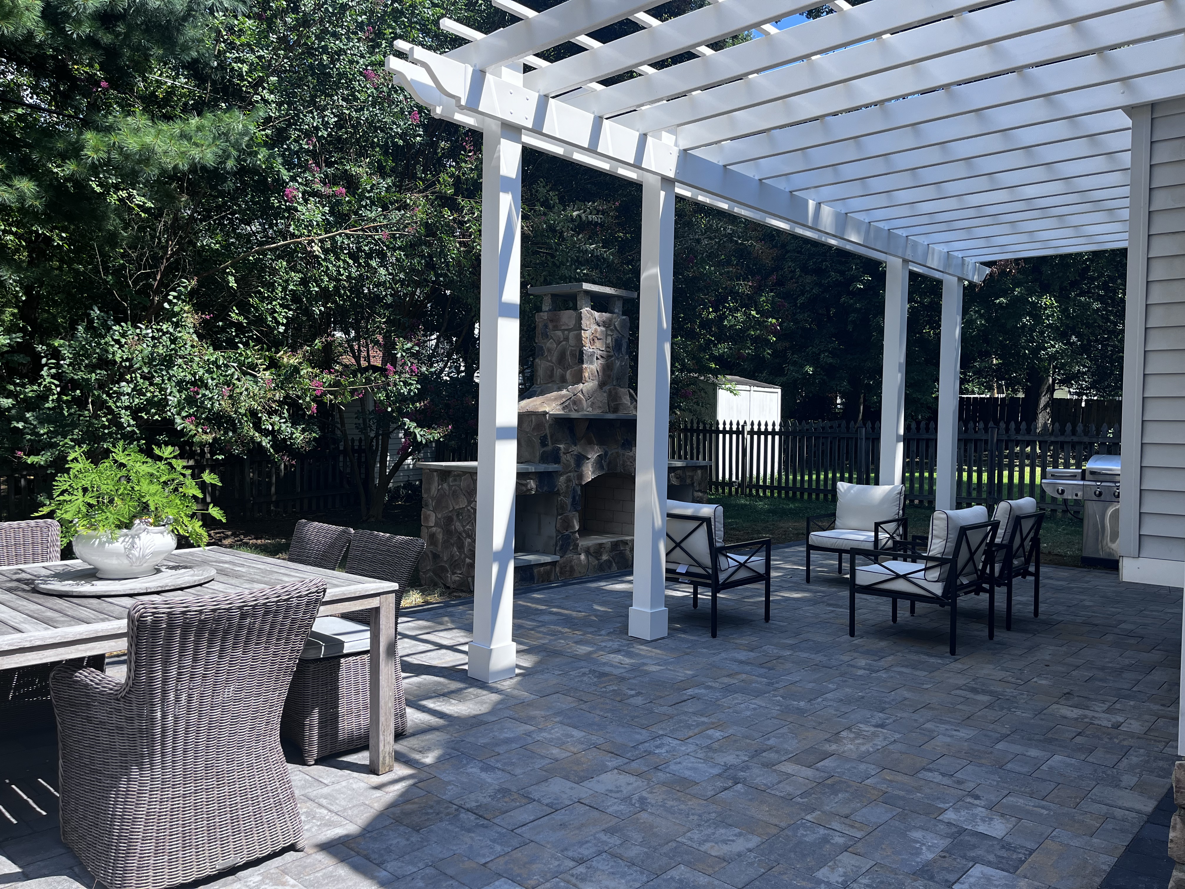 White Pergola & Outdoor Fireplace Patio