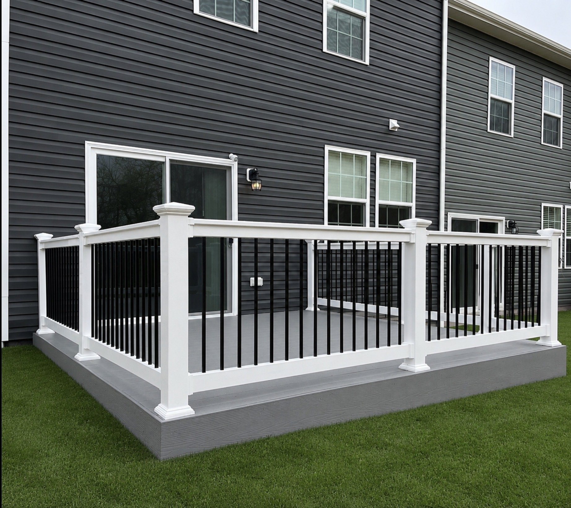 Ground-Level Composite Deck with White Railing