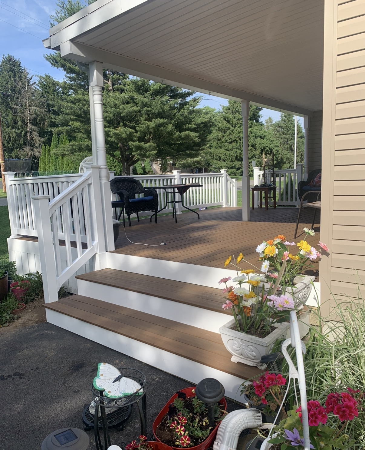 Covered Composite Porch Deck with White Railings