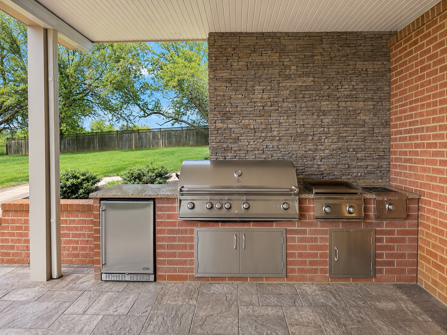 Covered Outdoor Kitchen with Brick & Stone Station