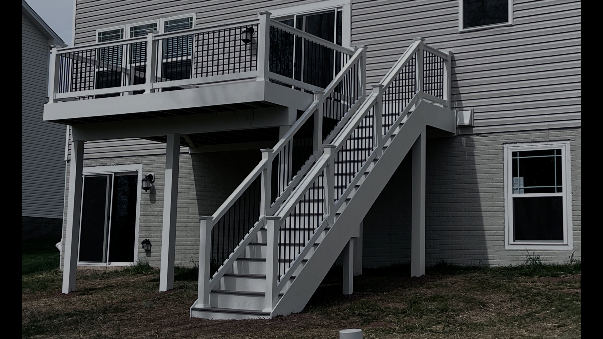 Elevated Deck Staircase with Black Balusters