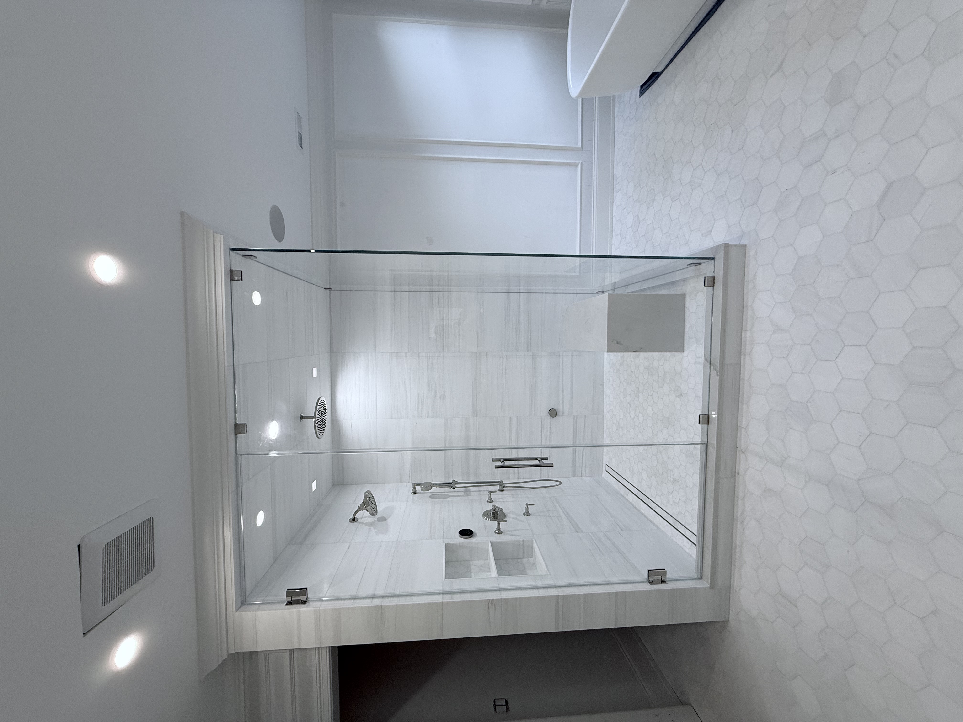 Modern frameless shower glass panels installed