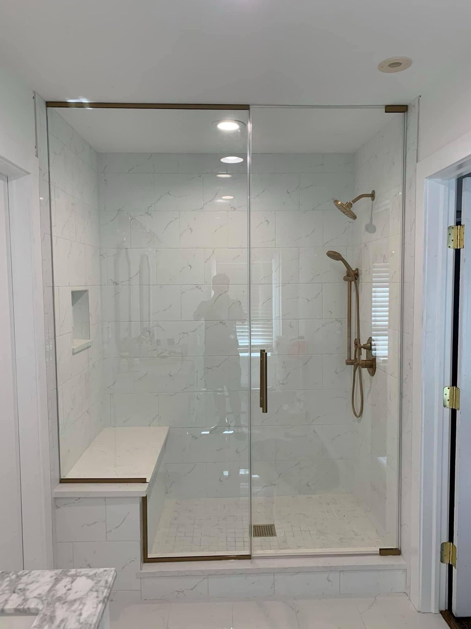 Custom glass shower enclosure for master bathroom