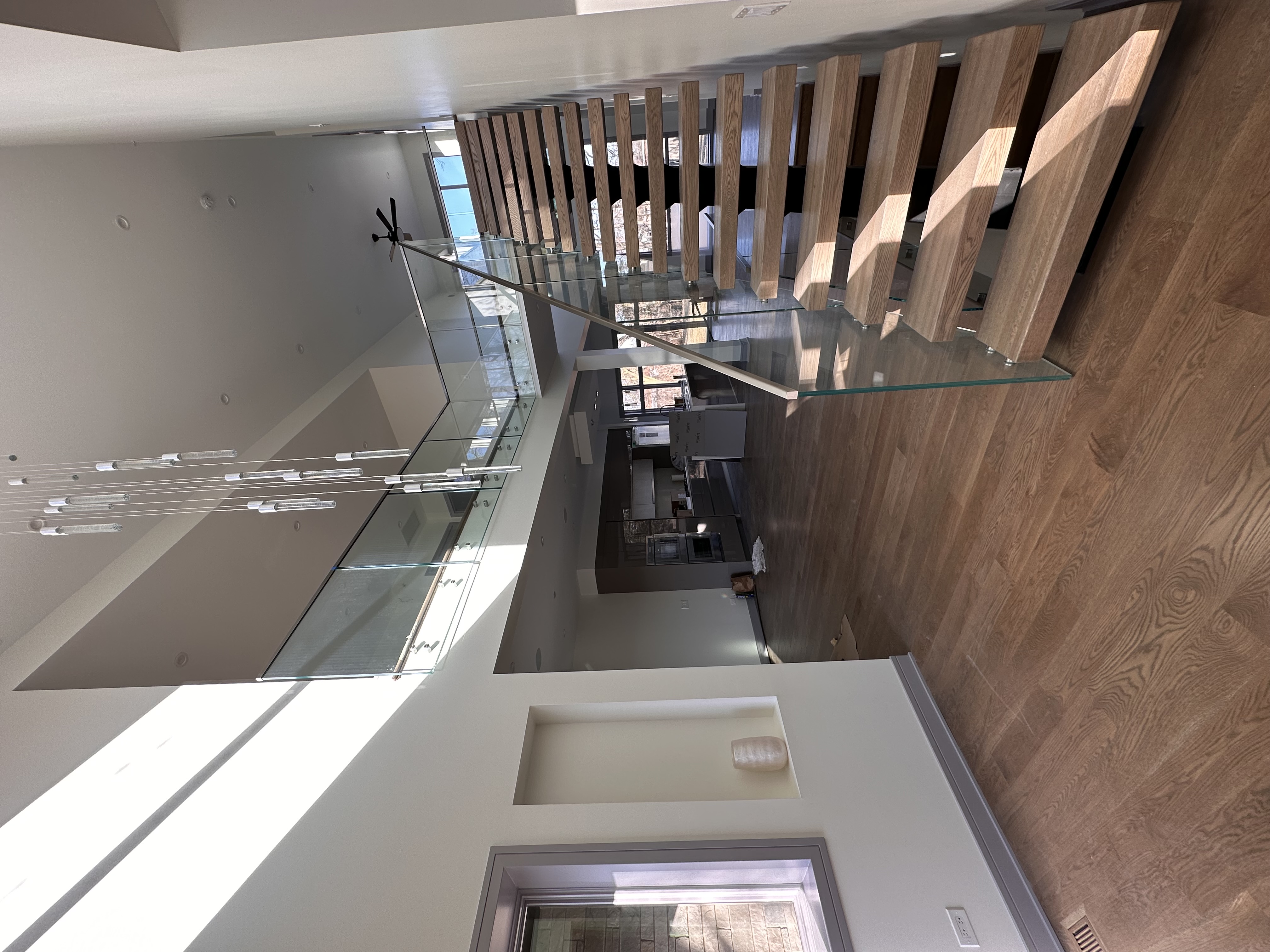 Standoff glass stair railing installation