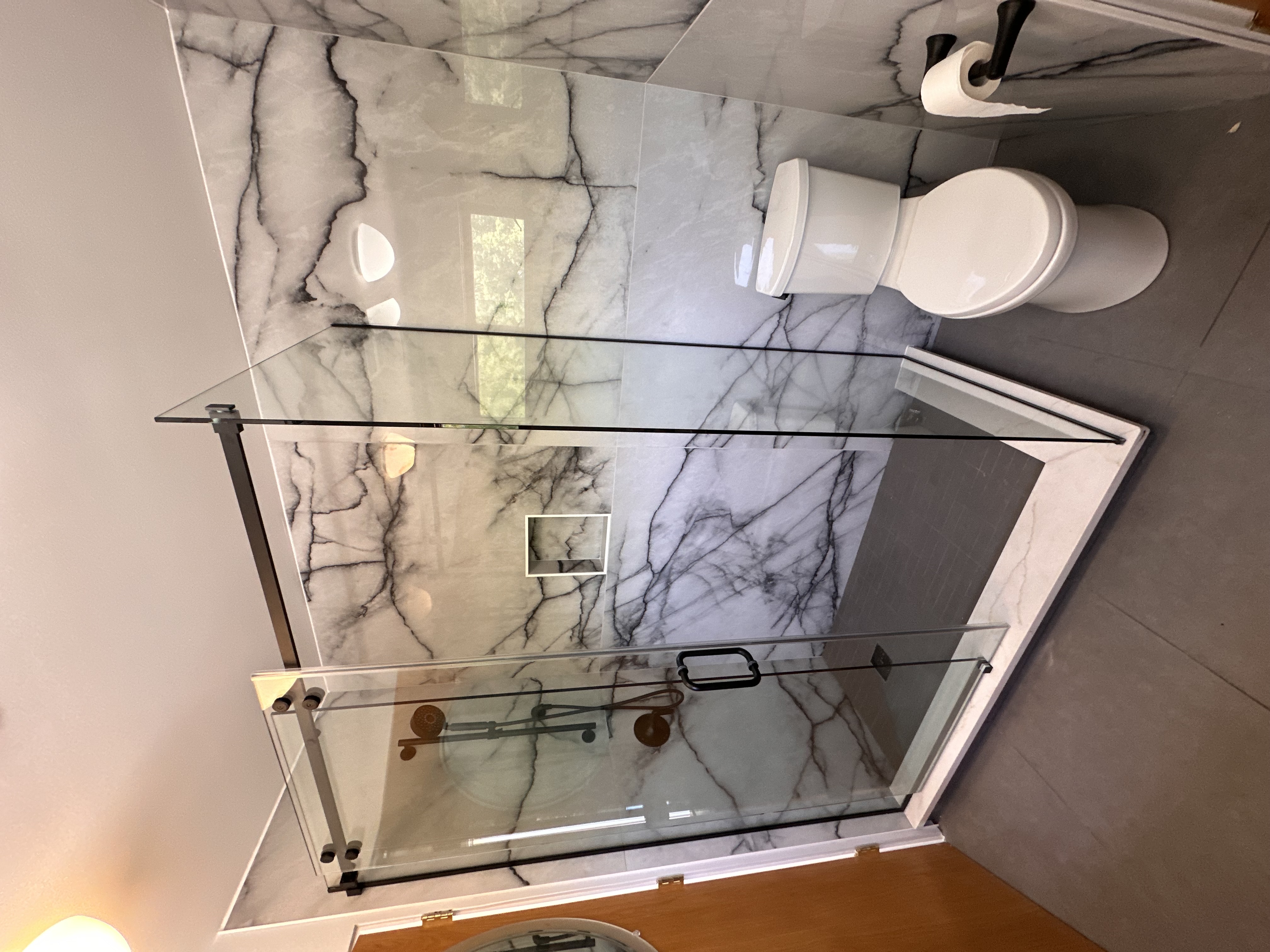 Frameless custom glass shower door installation in Chicago bathrooms