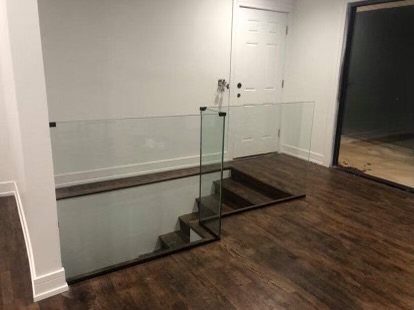 Frameless glass deck railing installed