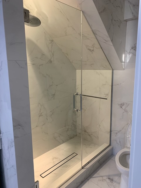 Custom measured frameless glass shower door