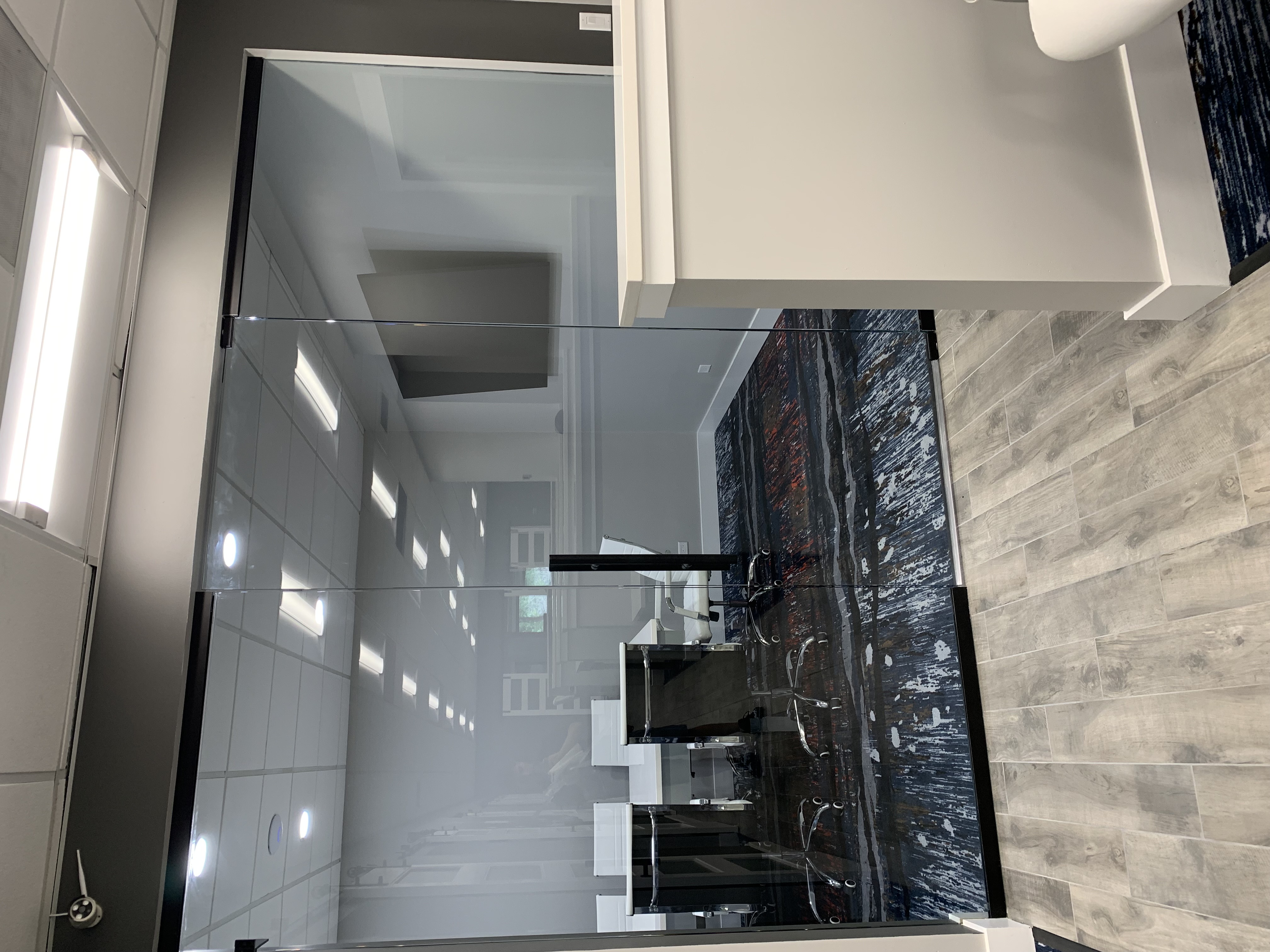 Frameless glass office partition installation