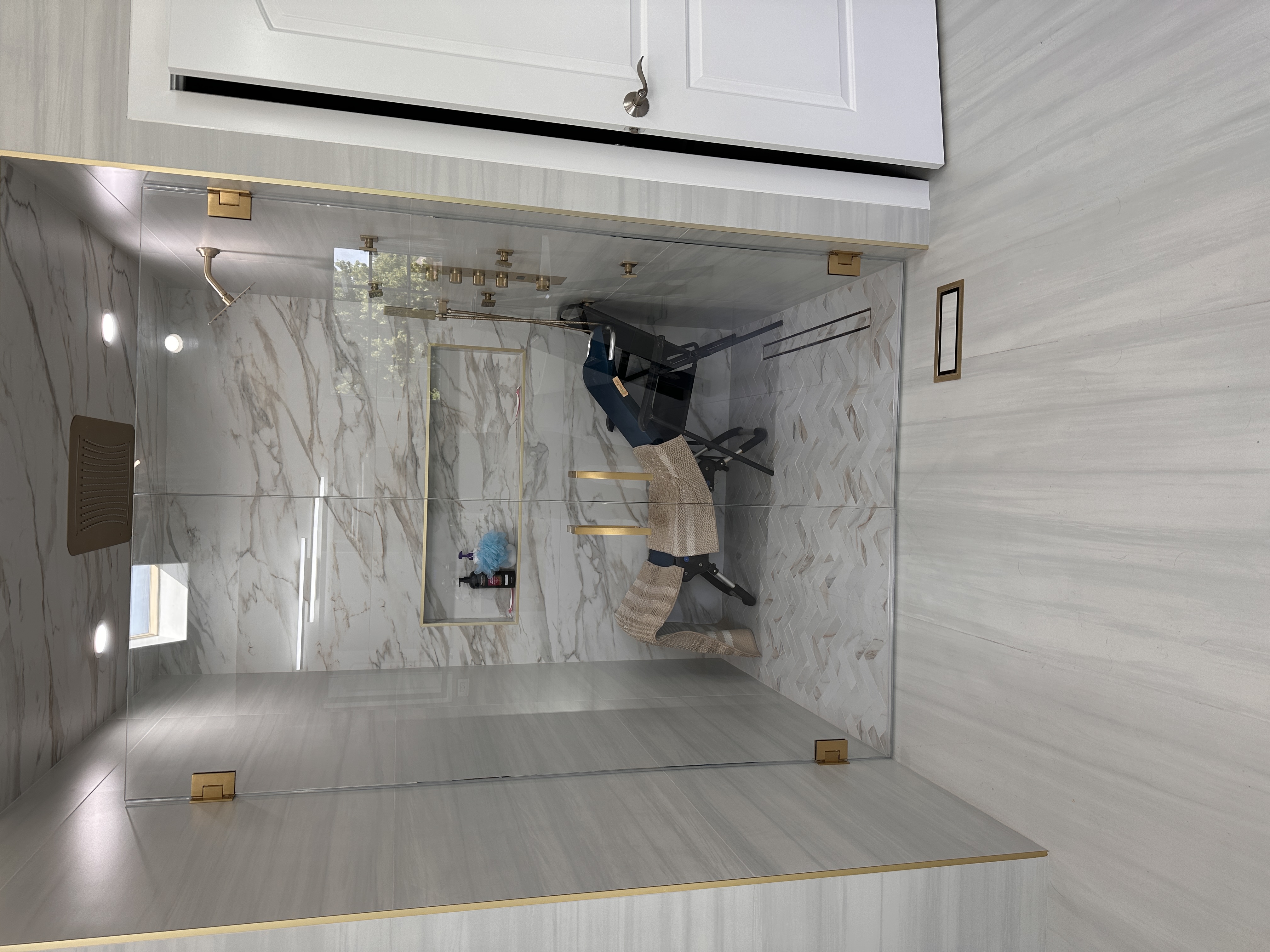 Semi-frameless glass shower enclosure installation