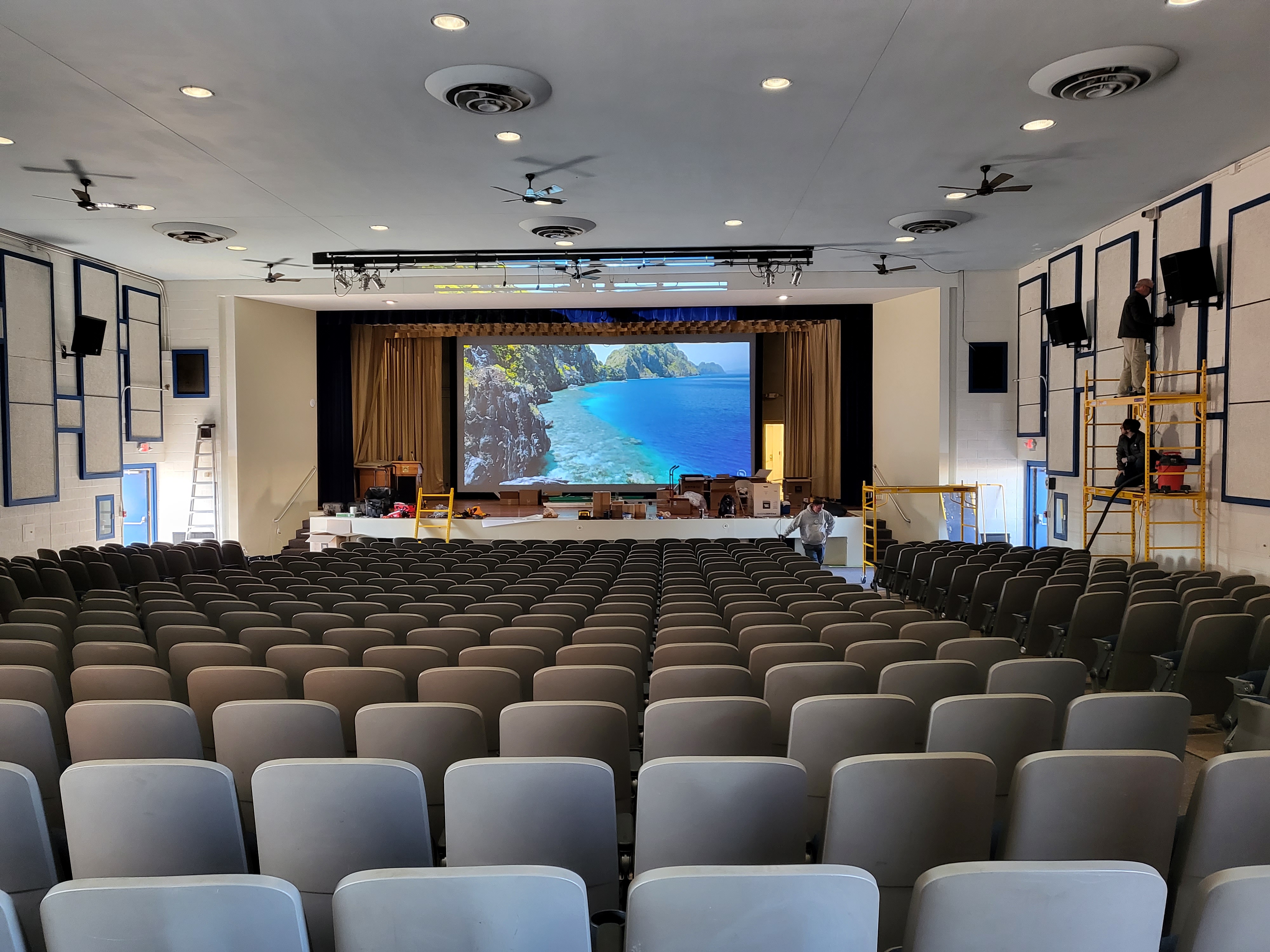 Action Technology Services technicians integrating audio visual systems in a government auditorium