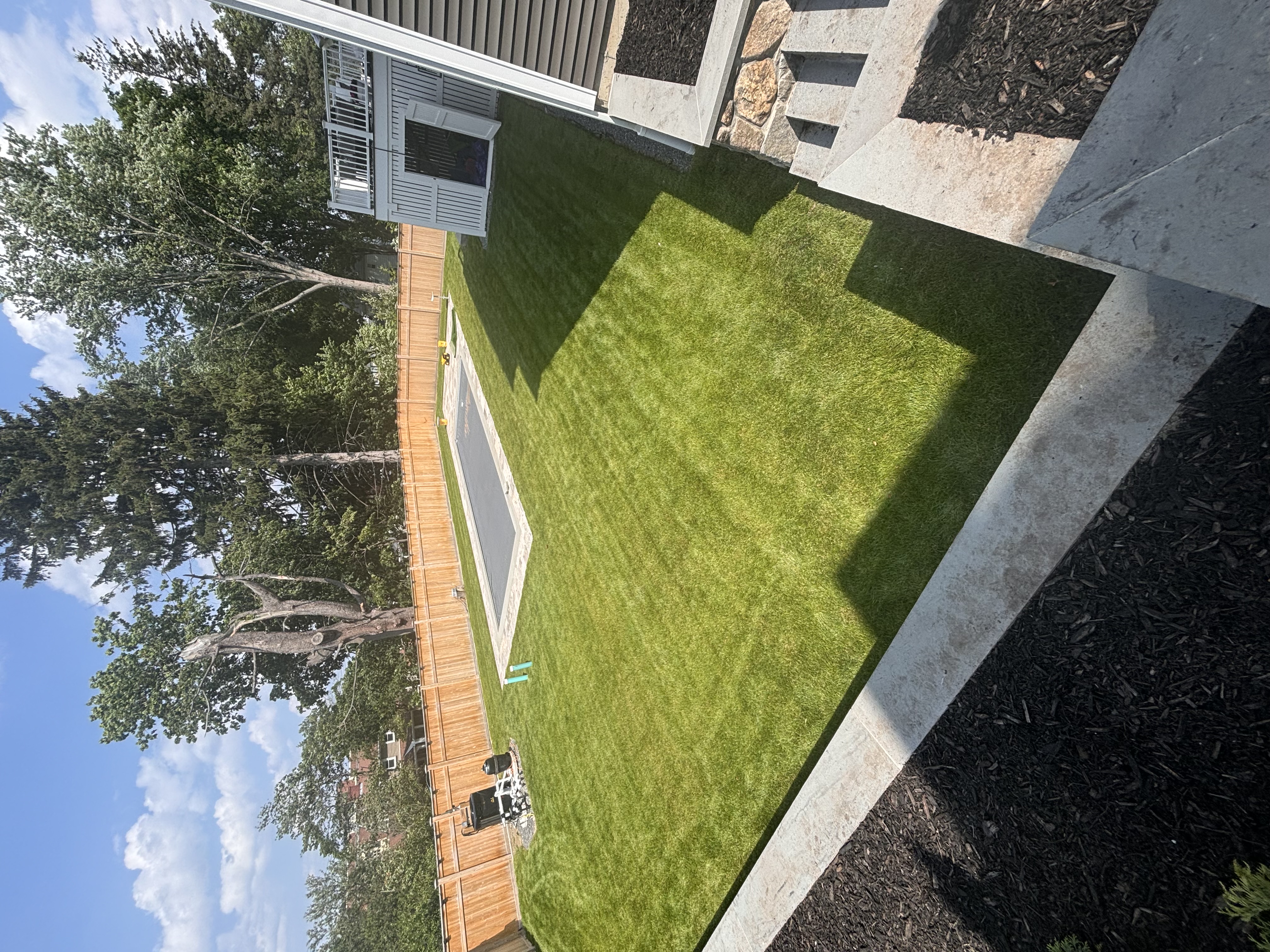 Manicured poolside lawn maintenance, Winchester, MA