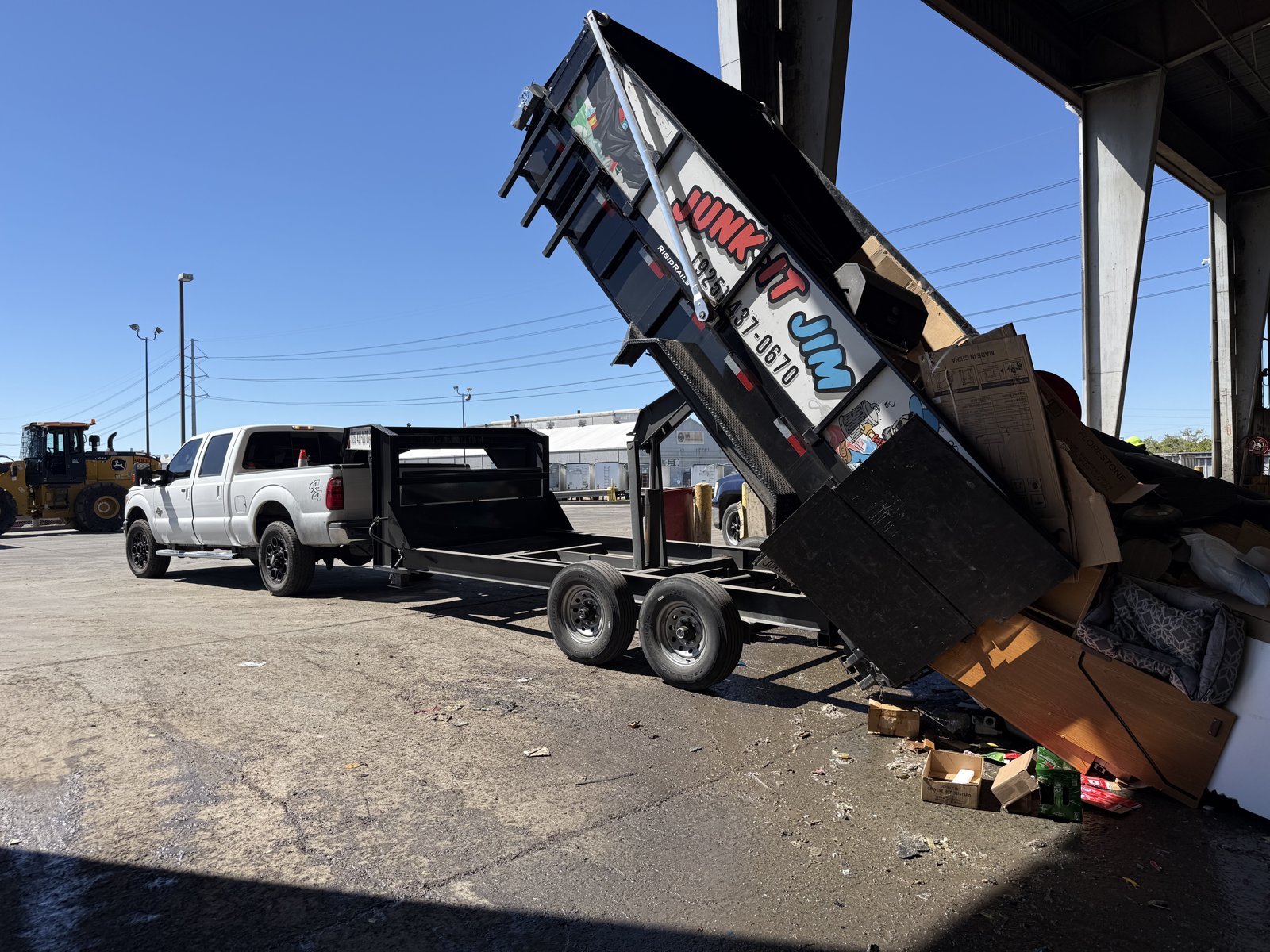 Junk It Jim trailer unloading at a licensed disposal facility