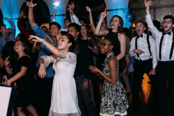 Packed dance floor with teenagers celebrating