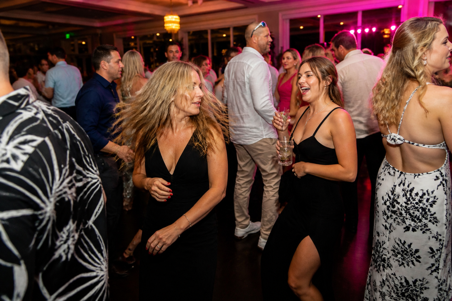 Packed dance floor at a corporate holiday party in South Florida