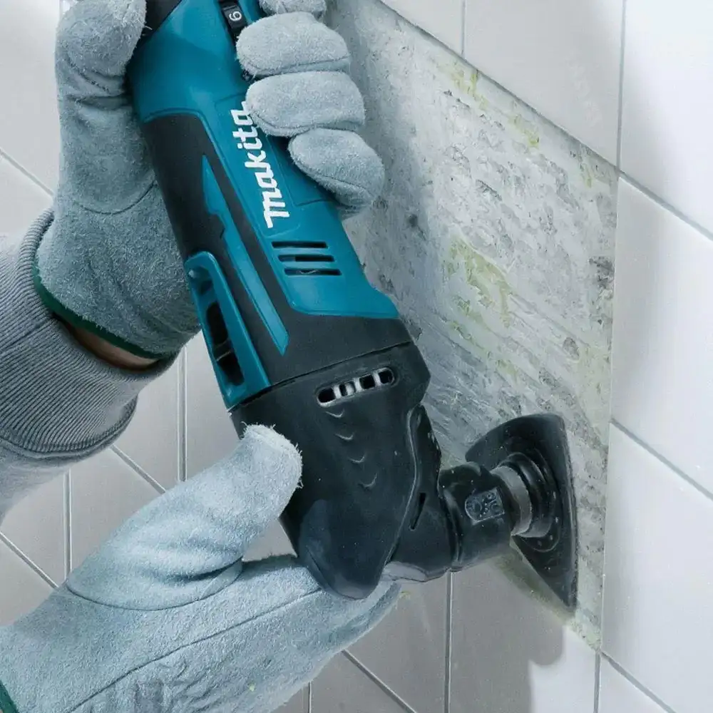 Professional plumber fixing tile work with high quality tools