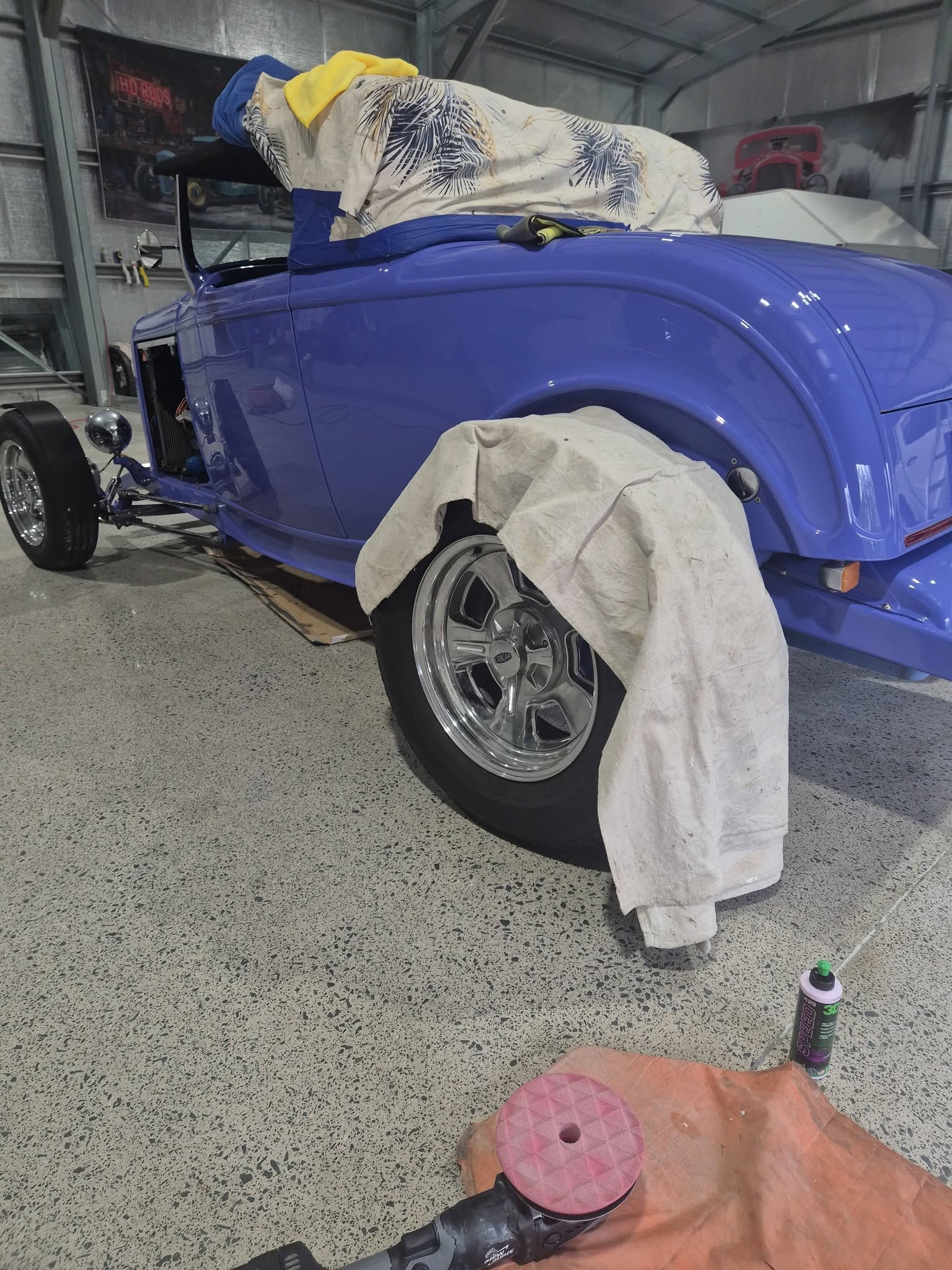 Blue hot rod side profile undergoing detailing at Groom Garage