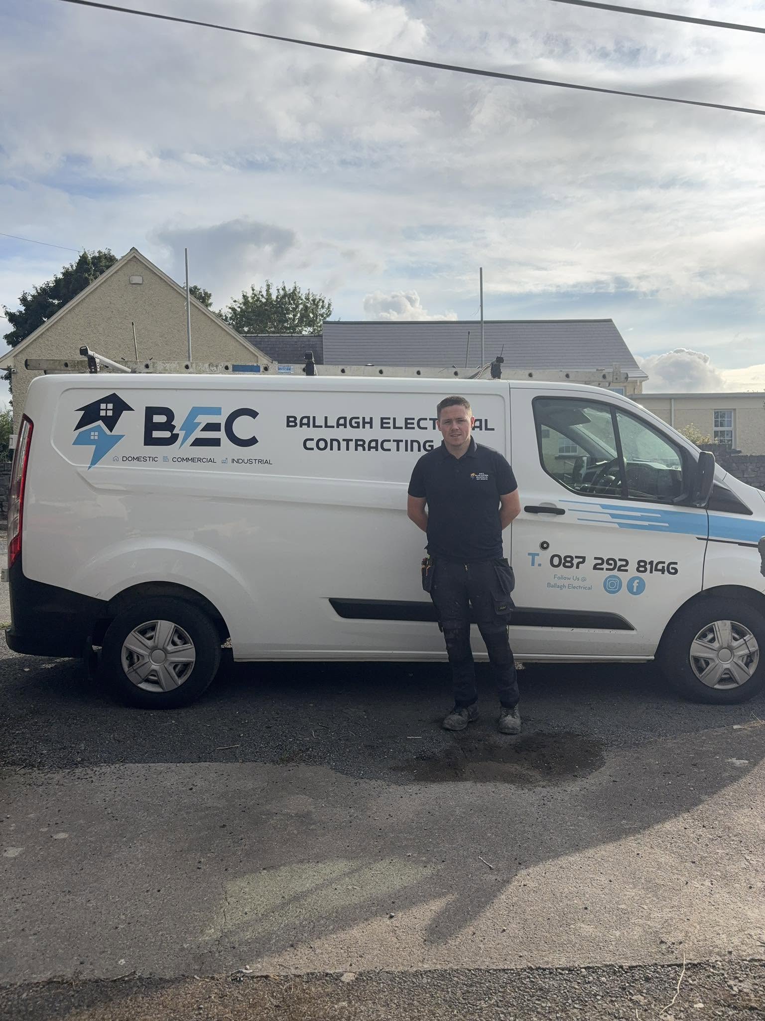 Nicky Kearns standing next to his company van