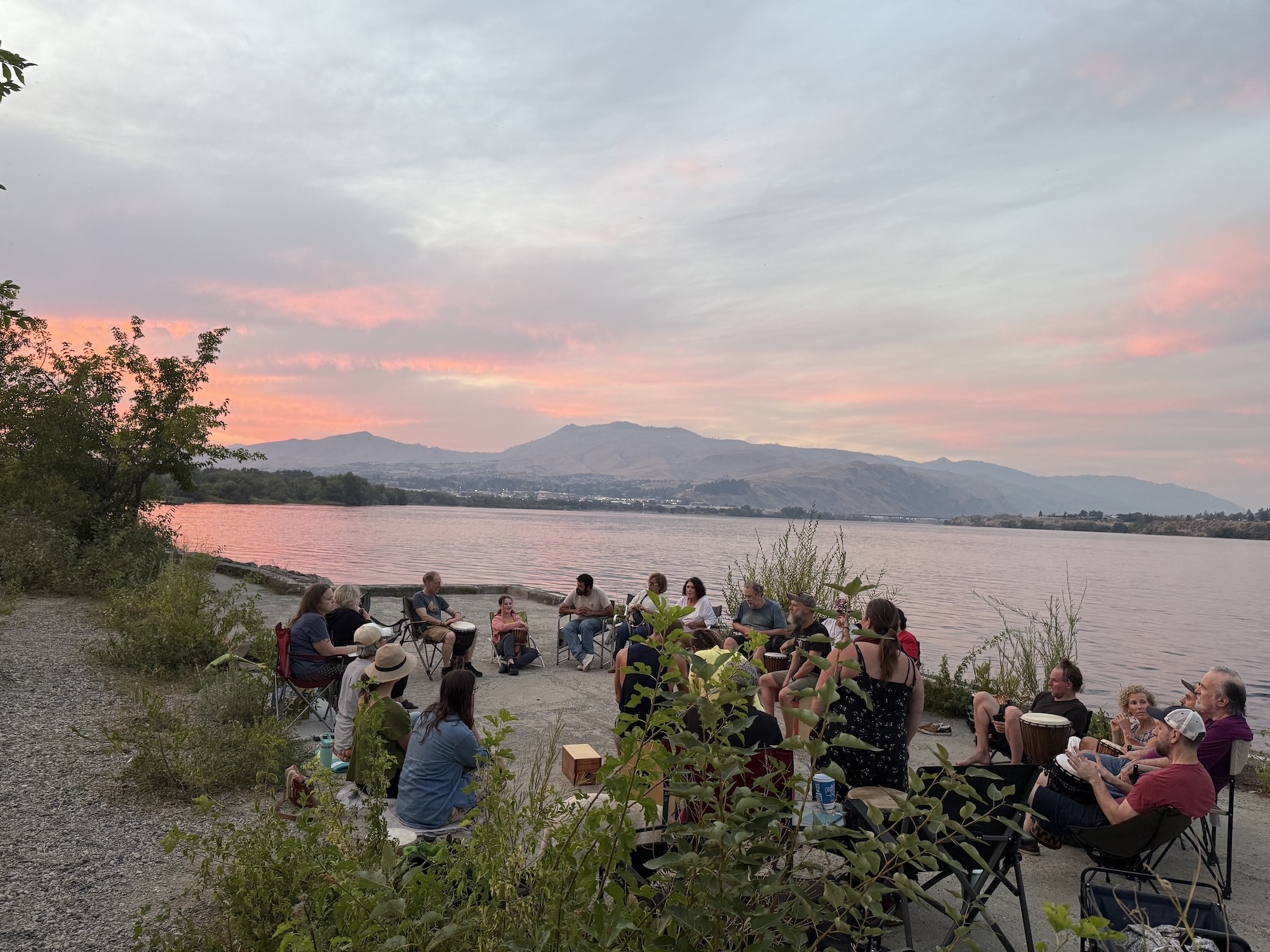 Song Circle by the water at sunset