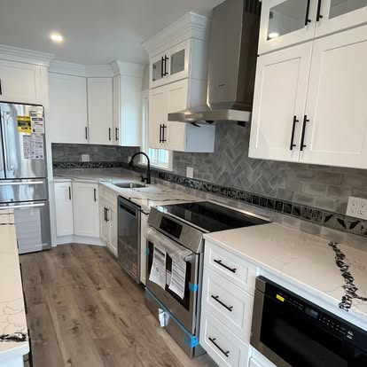 White custom kitchen cabinets and range hood