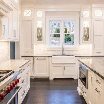 White custom kitchen cabinetry with farmhouse sink