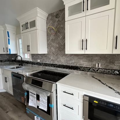 Kitchen remodel with herringbone backsplash