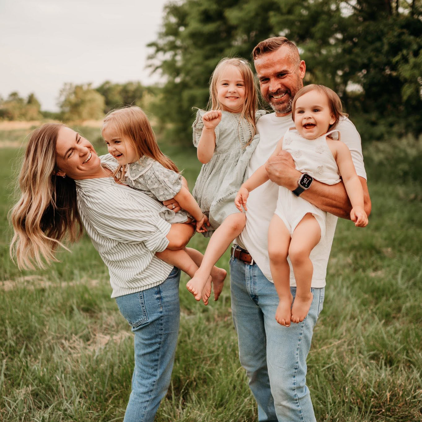 The JMT Restoration Services owner and his family — a warm, smiling family portrait showing the business is truly family owned and operated