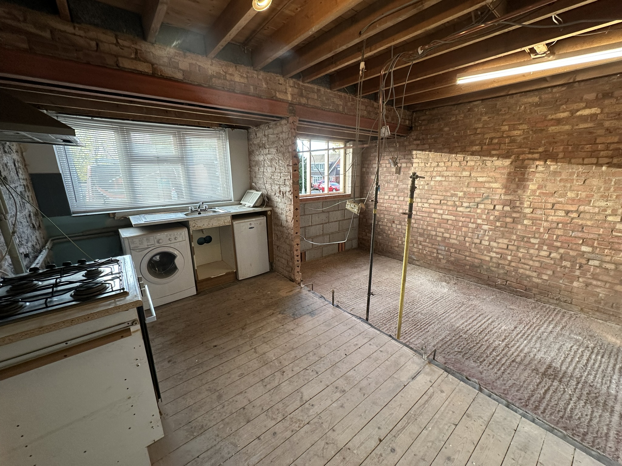 Existing garage space before conversion into a kitchen
