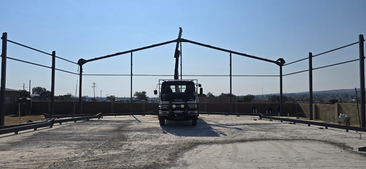 Crane truck erecting a steel structure