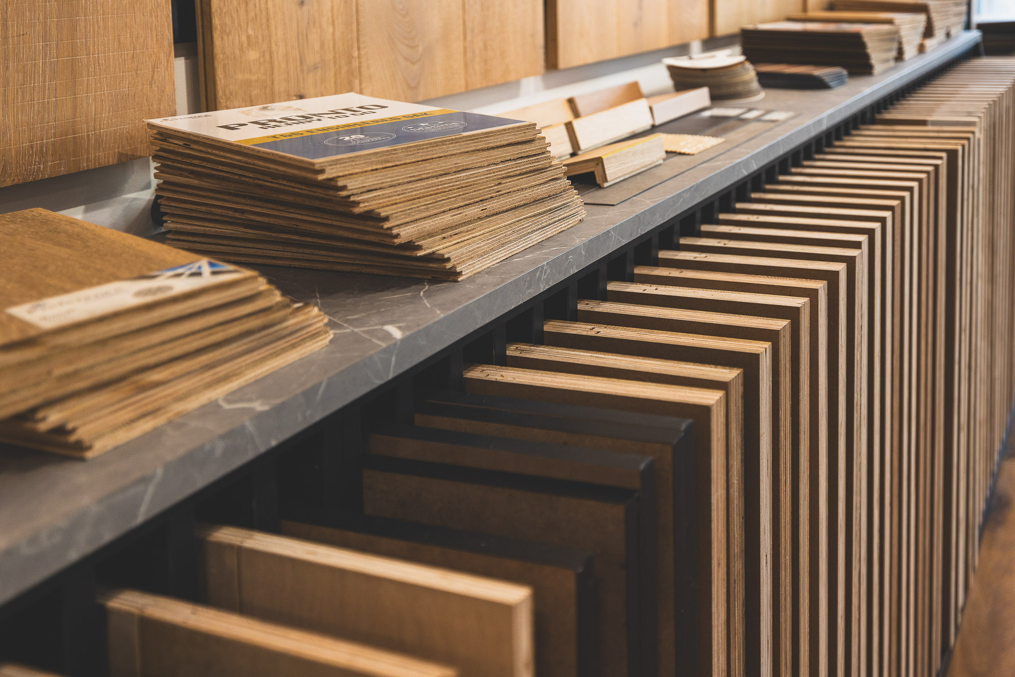 Wide selection of high-quality timber flooring sample boards and color swatches arranged neatly