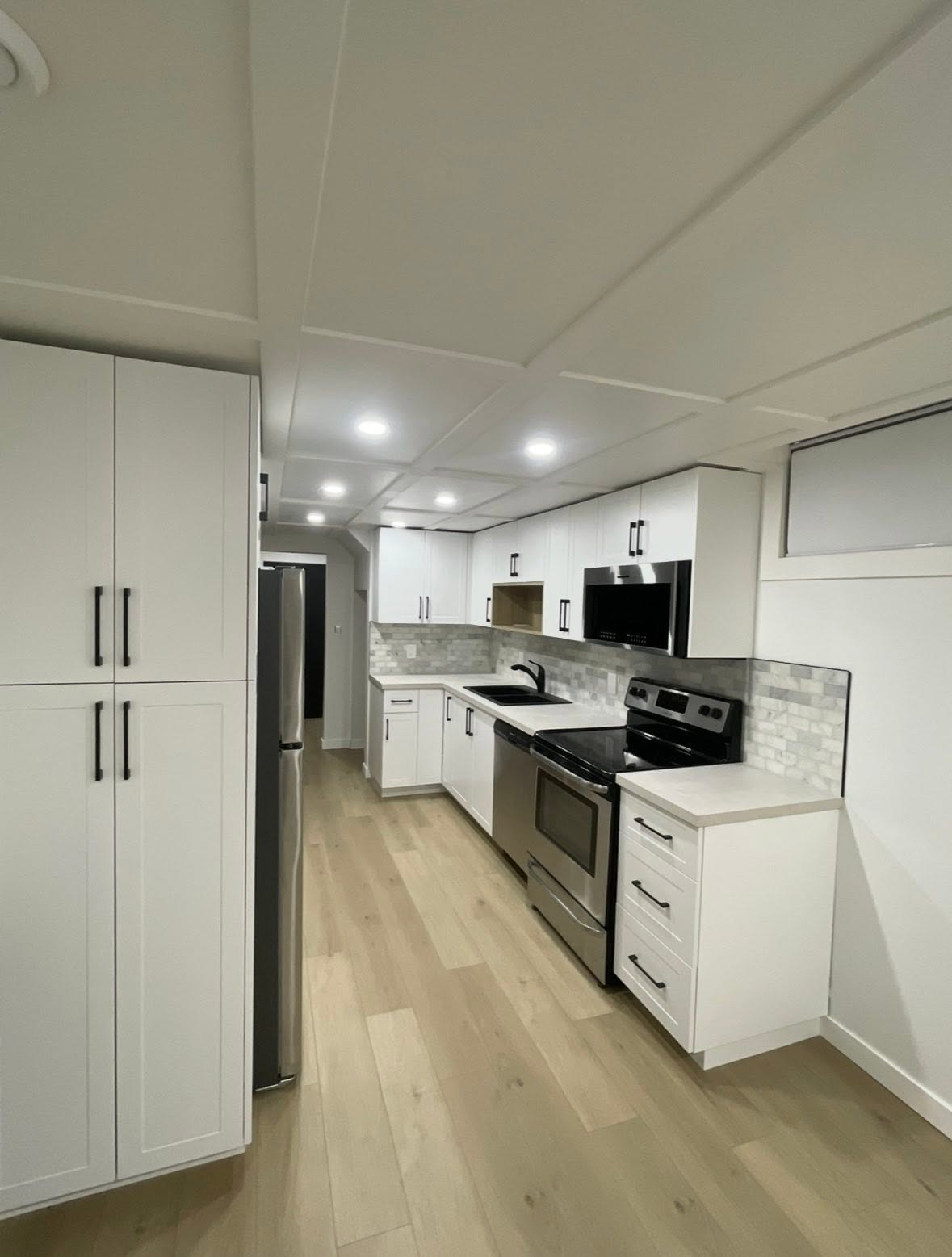 Cabinet hardware updates — CMB Handyman Services handyman project in Saskatoon
