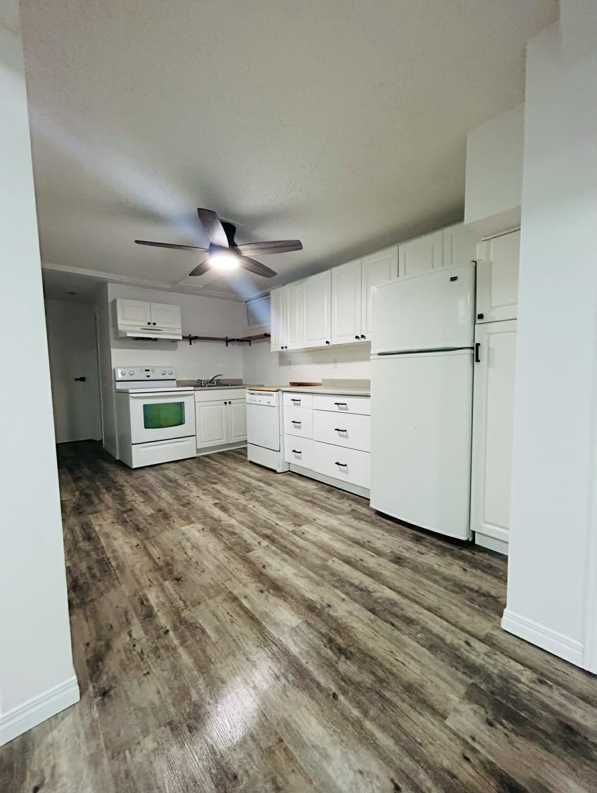 LVP and laminate installation — CMB Handyman Services handyman project in Saskatoon
