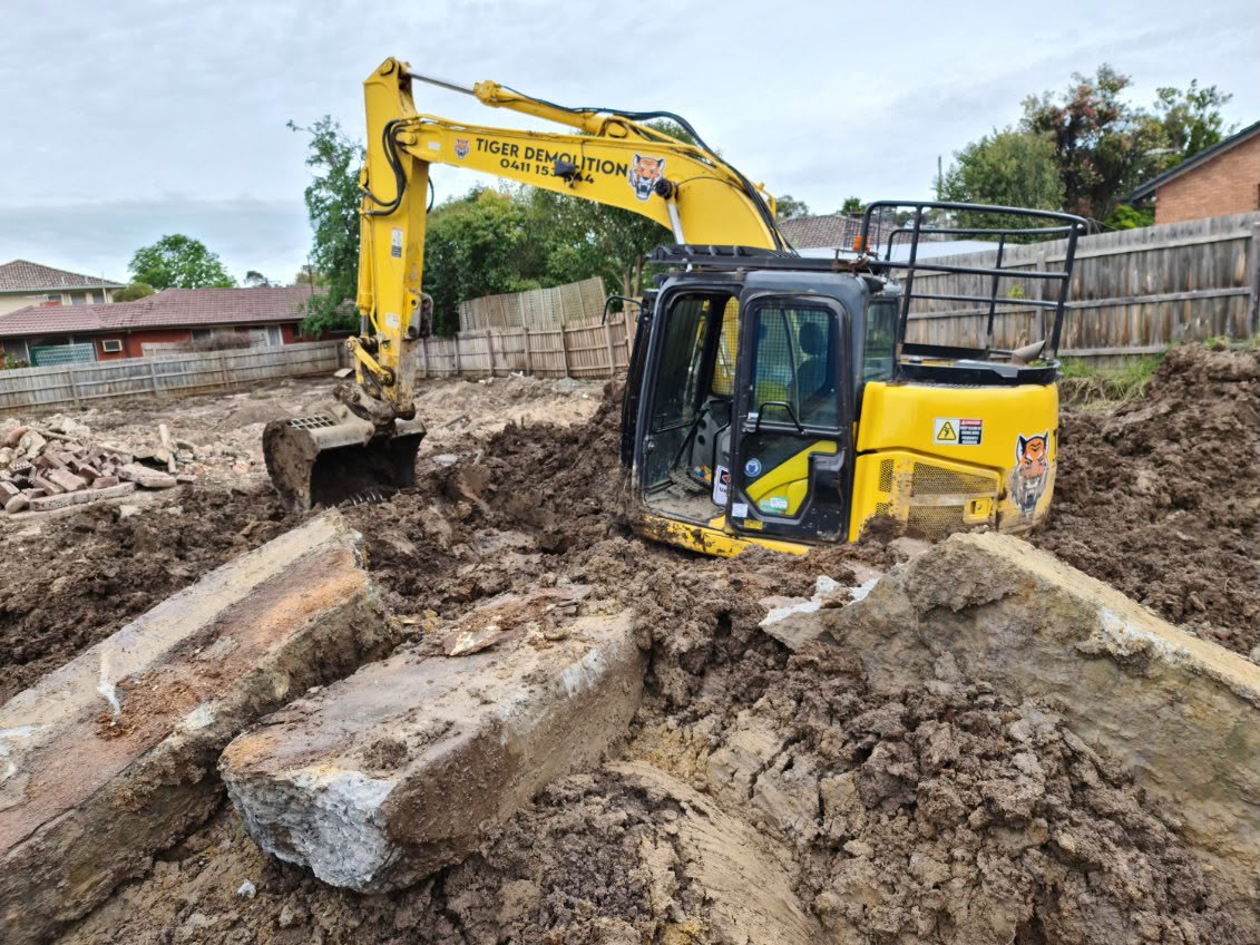 Excavator on construction site for home extension in Melbourne