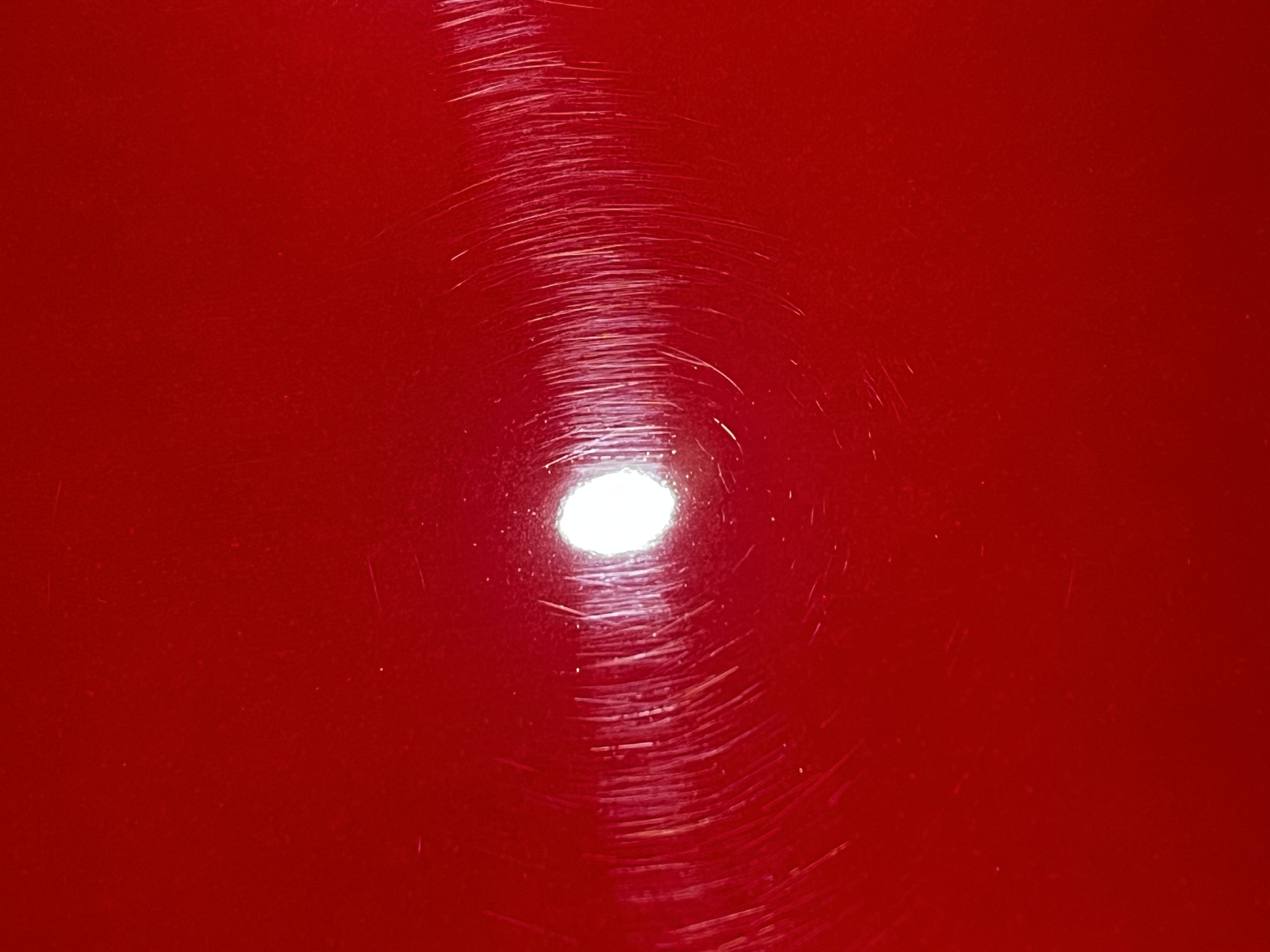 Red Paint Swirls Before Correction