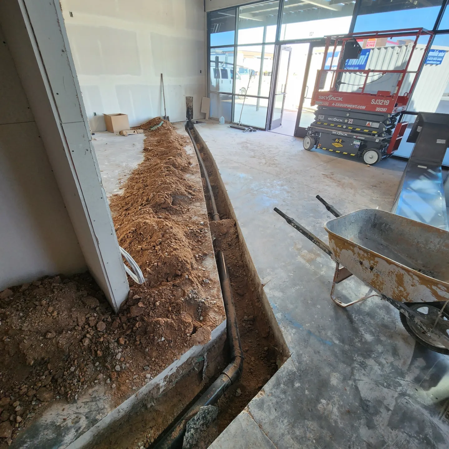 General contractor reviewing project plans at Phoenix commercial construction site