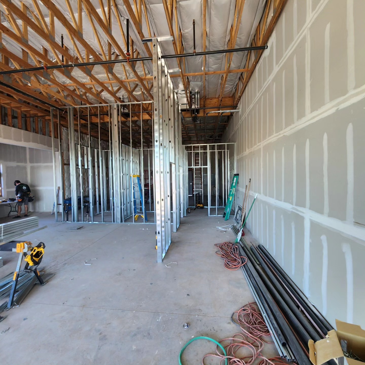 Commercial general contractor reviewing building plans on site