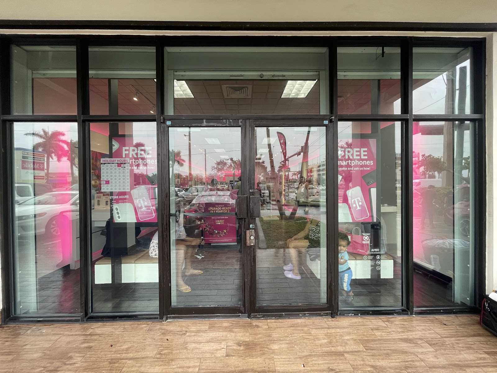 Retail storefront glass doors fitted with switchable smart film, Homestead, Florida