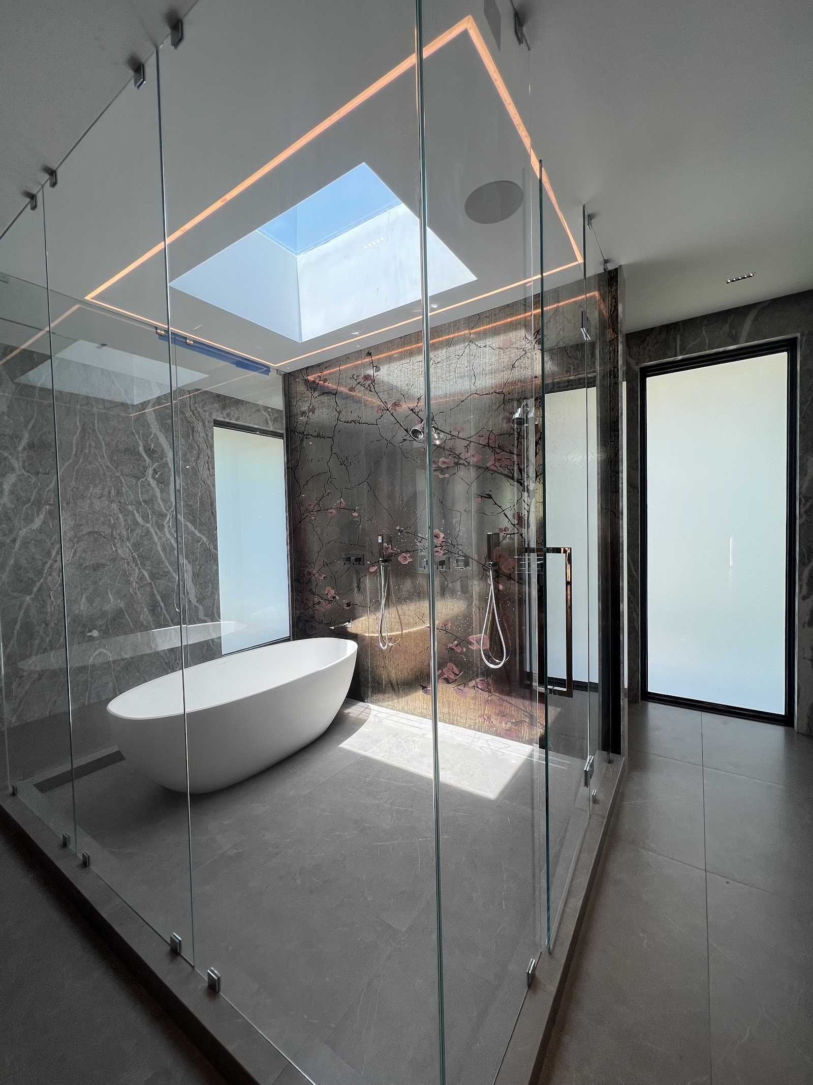 Frameless shower with smart film switched to frosted — privacy in under a second