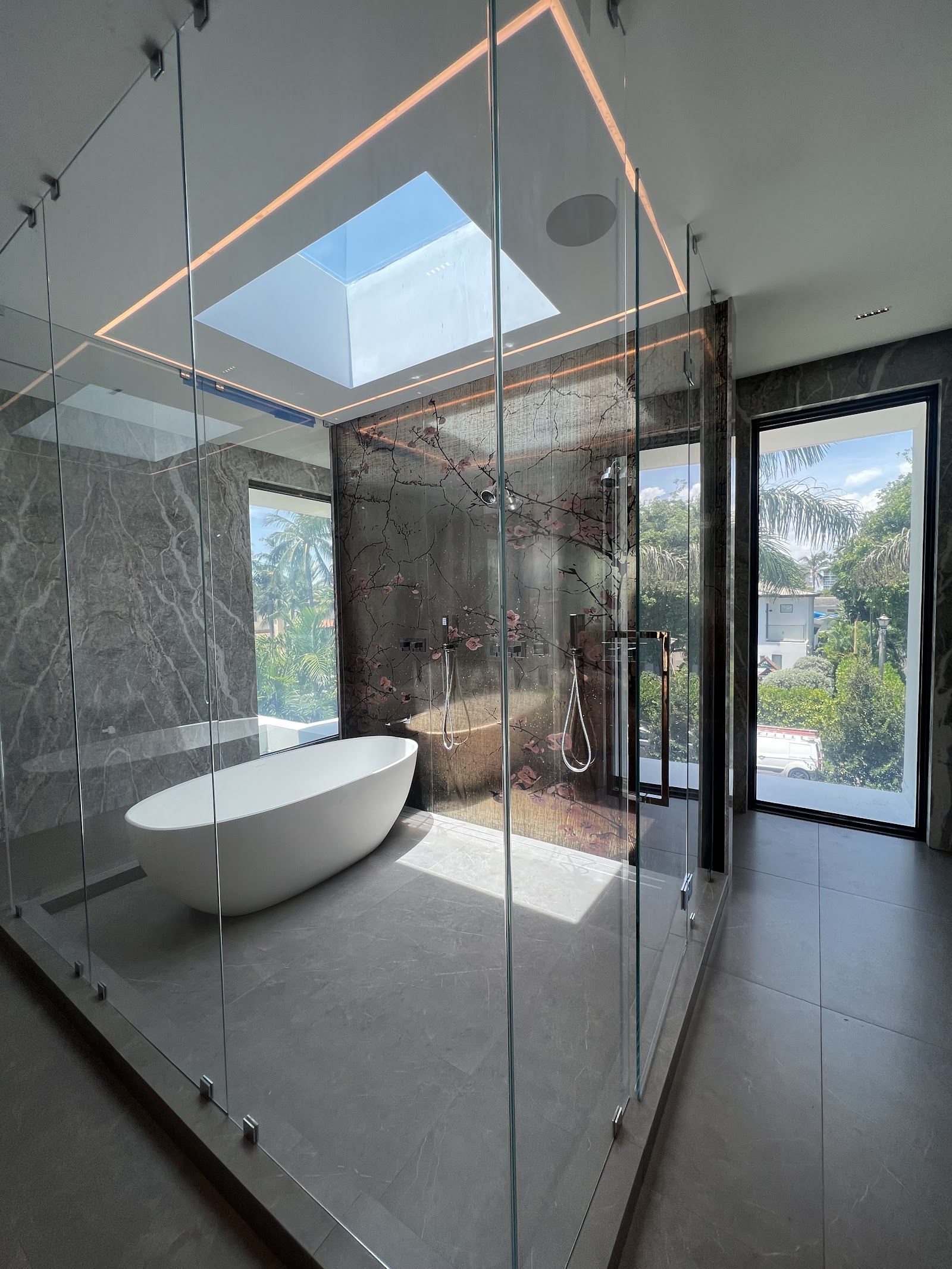 Frameless shower with smart film switched to clear — same glass, full view