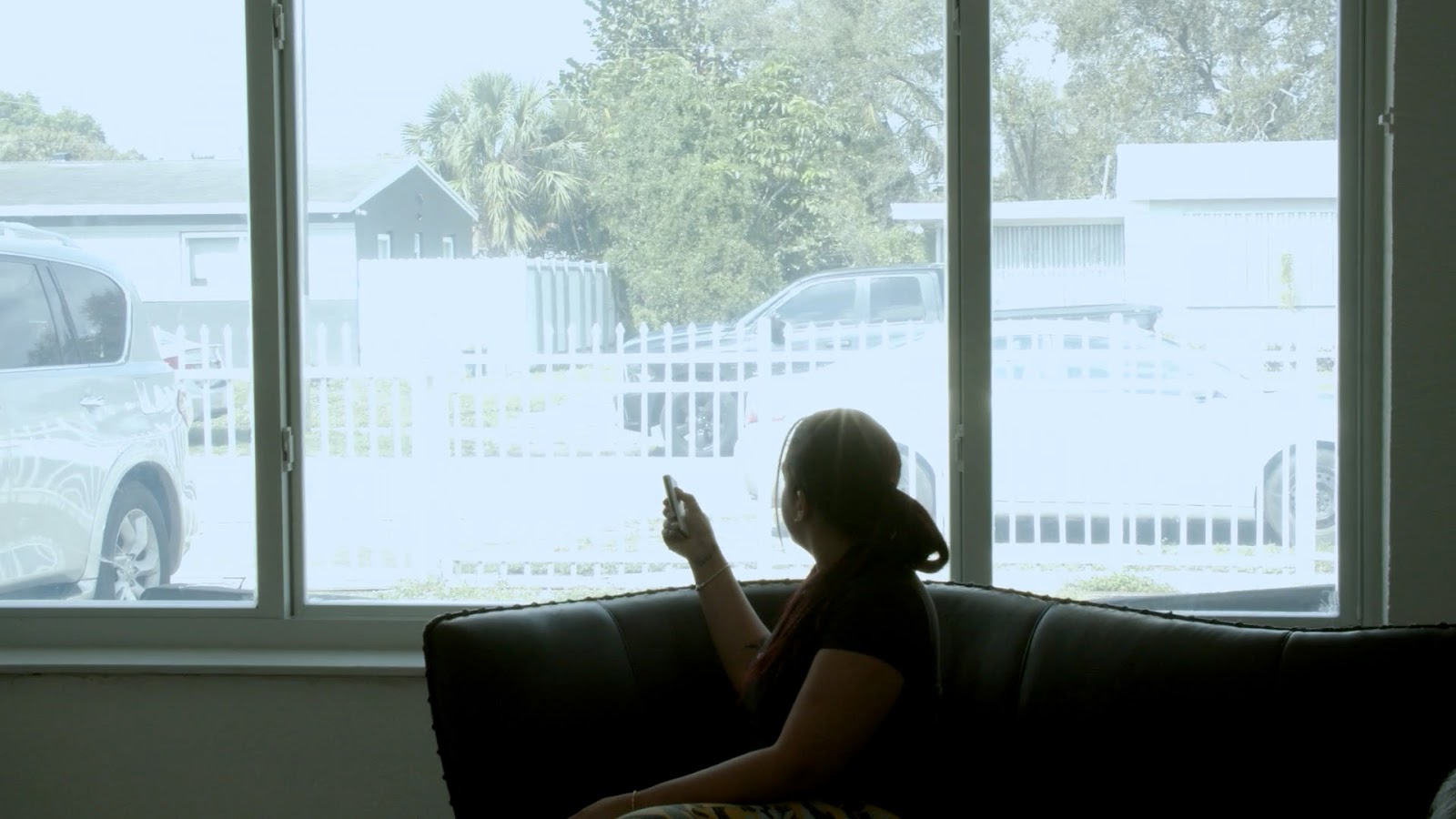 Living room window in a South Florida home with smart film in the clear state